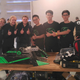 A team from Britain's Brentwood high school and Wang Xi's team in the reality TV show King of Bots.
